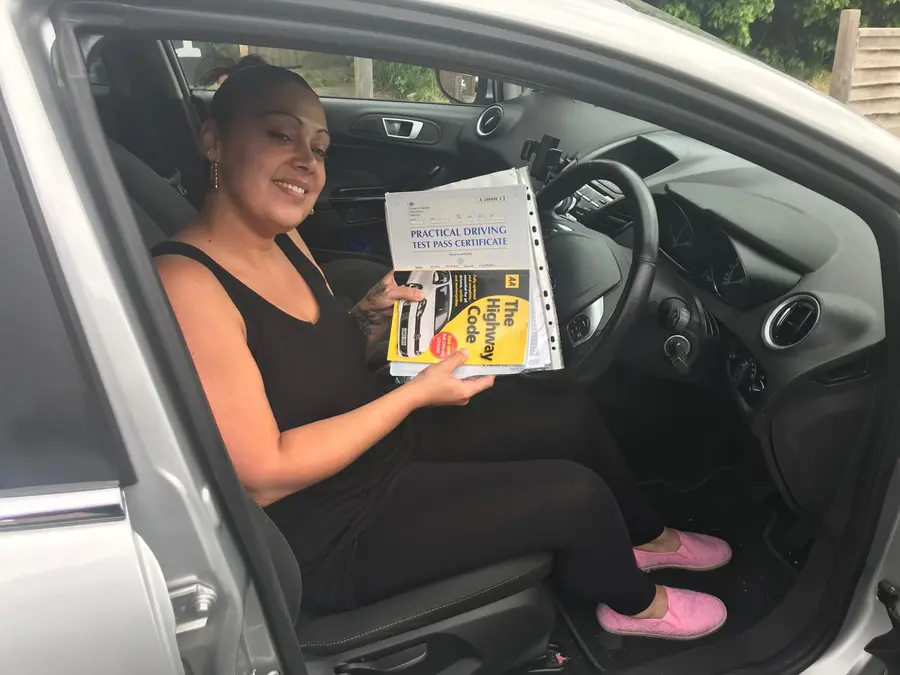 ACDAL learner celebrating a practical driving test pass 16