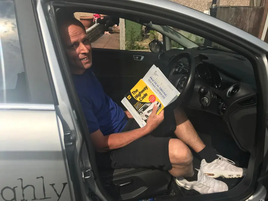 ACDAL learner celebrating a practical driving test pass 17