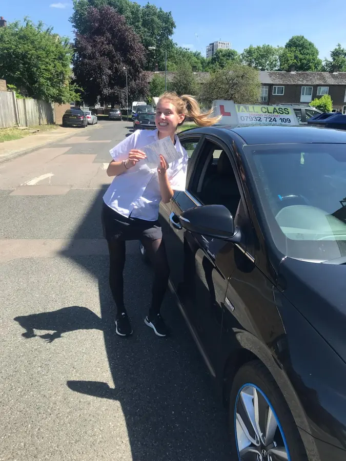 ACDAL learner celebrating a practical driving test pass 30